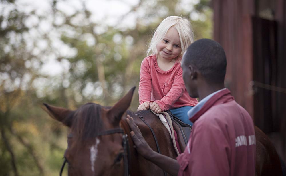 Family rides Chyulu Hills